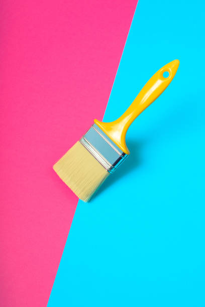 istock Paint brush on vibrant colorful background 869614076