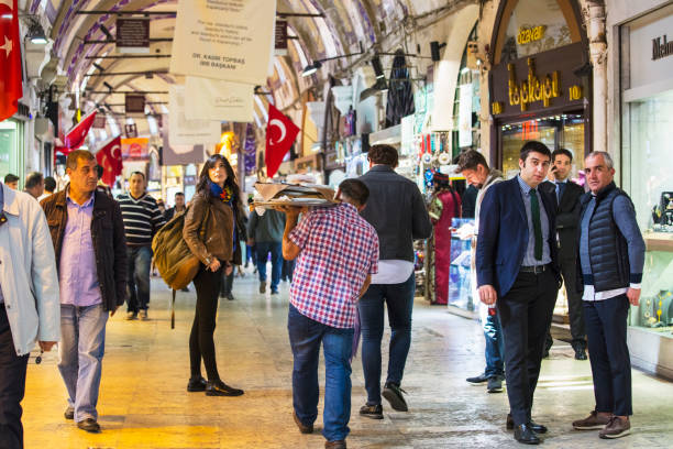 Istanbul, Turkey - October 10, 2017: People shopping in the Grand Bazaar. This is one of the largest and oldest covered markets in the world.