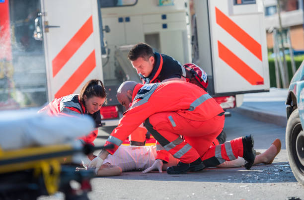 istock Paramedic Doctor Examining 869617578