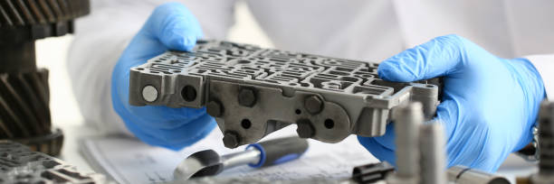 istock The auto repair service repairman in automatic gearboxes 869617996