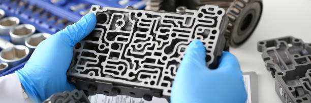 istock The auto repair service repairman in automatic gearboxes 869618016