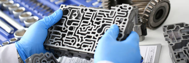 istock The auto repair service repairman in automatic gearboxes 869618042