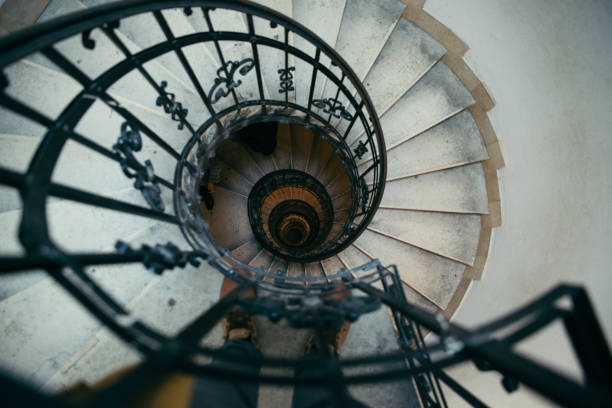 istock spiral stairs in old house 869619700