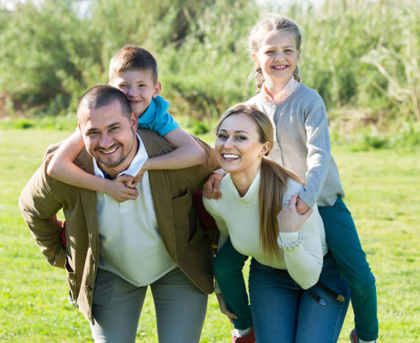 istock Joyful parents with children outdoor 869620008