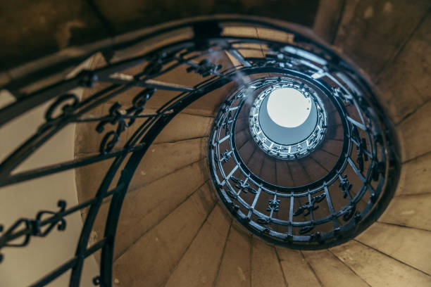 istock spiral stairs in old house 869622324