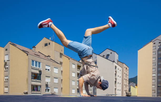 istock Breakdancer Dancing on a Roof in a City 869623142