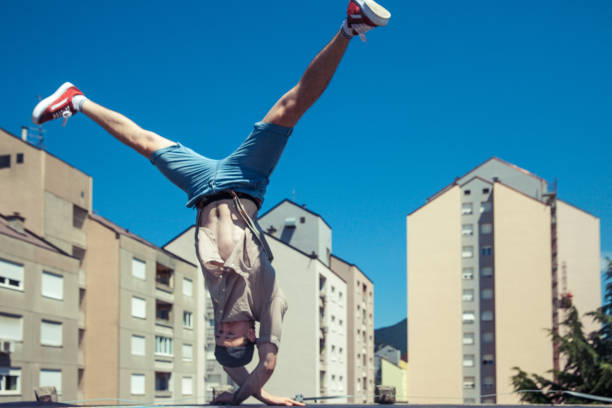 istock Breakdancer Dancing on a Roof in a City 869623180