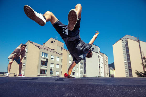 istock Breakdancers Dancing on a Roof in a City 869623190
