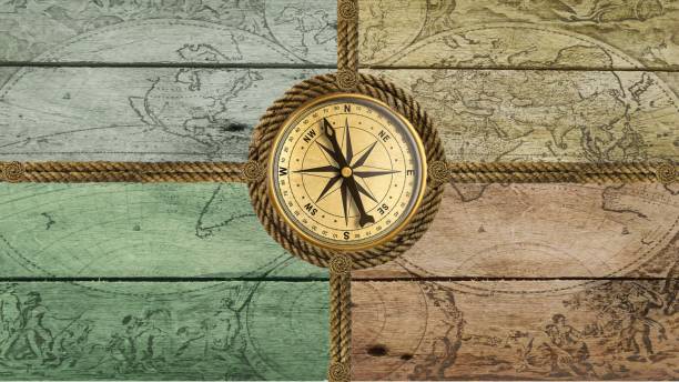 Compass anchor steering wheel Compass anchor steering wheel made of ropes on old wood sunset dew stock pictures, royalty-free photos & images