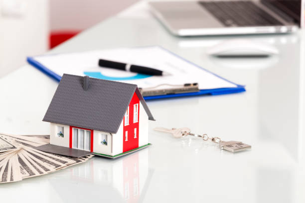 istock Real Estate Concept With Miniature House 869626164