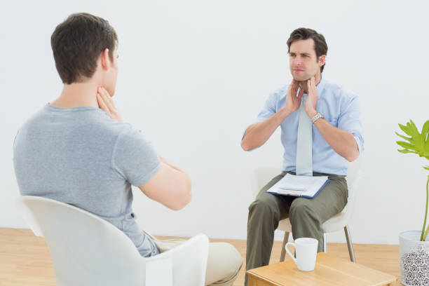 istock Well dressed male doctor in conversation with patient 869629934