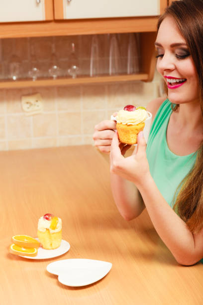istock Woman drinking coffee and eating delicious cake. 869630100