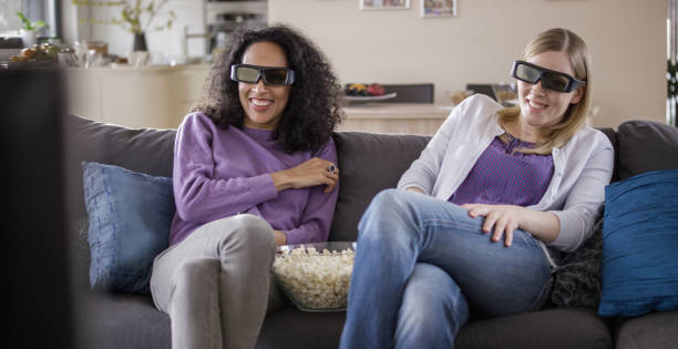 istock Friends watching TV with 3D glasses 869630748