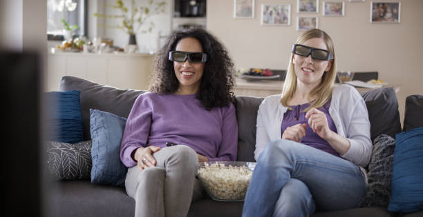 istock Friends watching TV with 3D glasses 869630766
