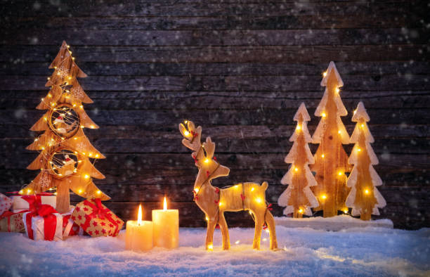 istock Christmas backgound with illuminated moose and christmas tree. 869634746