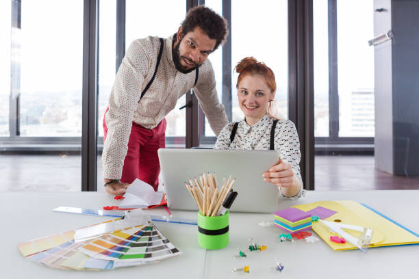 istock Business people in modern office posing for camera. 869637296