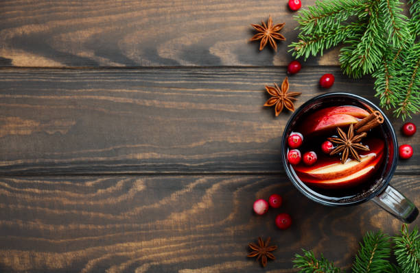 christmas mulled wine with apple and cranberries. holiday concept decorated with fir branches, cranberries and spices. - fruit freshness tree foods and drinks imagens e fotografias de stock