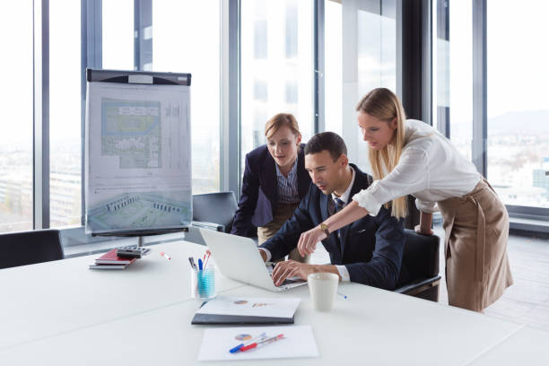 istock Business people in modern office working on project. 869638138