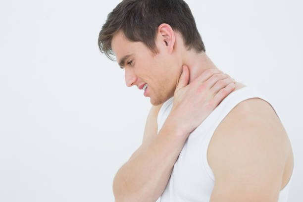 istock Closeup side view of a man suffering from neck pain 869638314