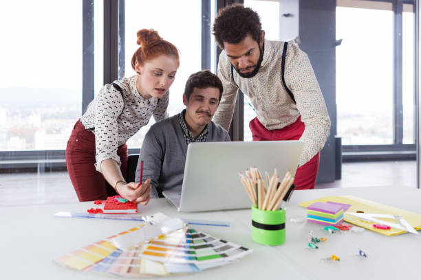 istock Business people in modern office working on project. 869638590