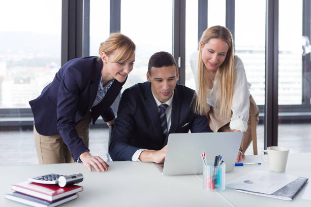 istock Business people in modern office working on project. 869638746