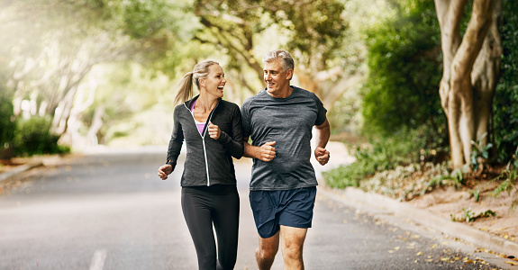 Shot of a mature couple out jogging on a sunny day