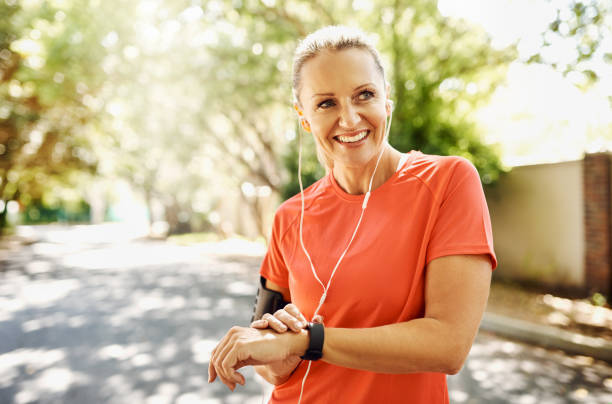 I still have quite a spring in my step Cropped shot of a mature woman out for her morning run pedometer photos stock pictures, royalty-free photos & images