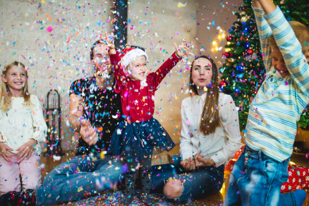 istock Family throwing confetti at Christmas 869645794