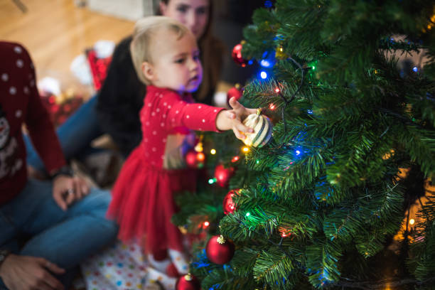 istock Family decorating the Christmas tree 869645924