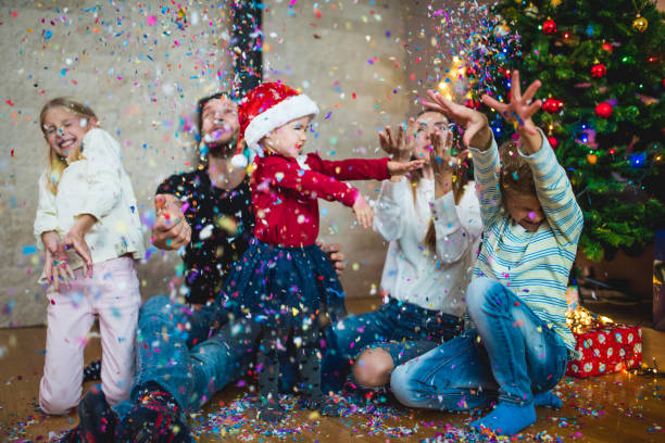 istock Family throwing confetti at Christmas 869646032