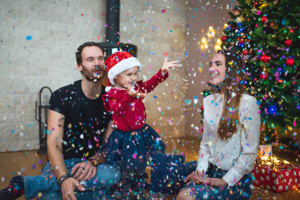istock Family throwing confetti at Christmas 869646116