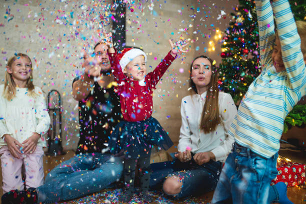 istock Family throwing confetti at Christmas 869646282