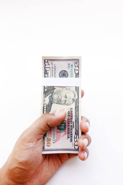 istock close up of banknote on hand 869647452
