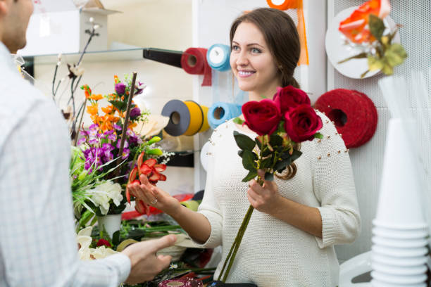 istock seller helping to pick flowers 869647536