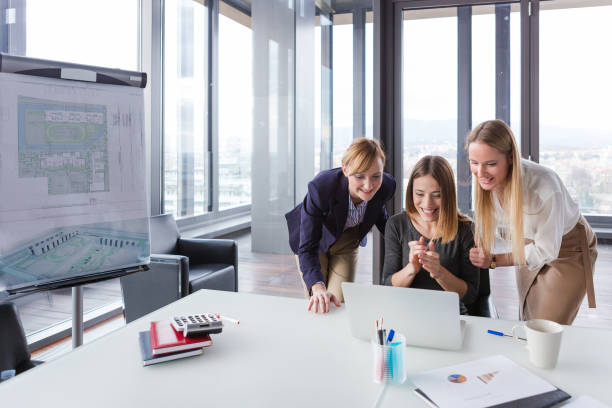 istock Three business women in modern office working on the project together. 869647692