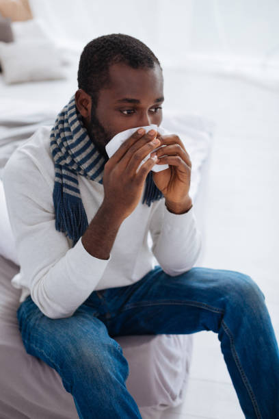 istock Unlucky young man staying at home and being ill 869651524