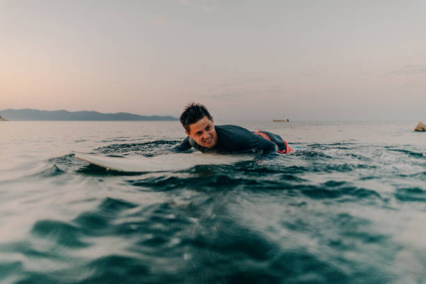 istock Portrait of a smiling surfer 869654816