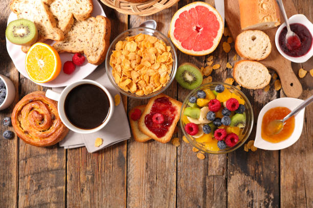 istock breakfast with coffee, fruit,cereal and croissant 869657862