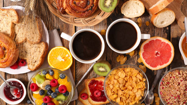 istock breakfast with coffee, fruit,cereal and croissant 869657874