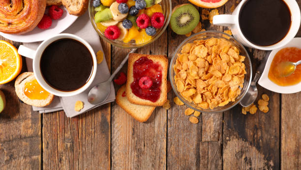 istock breakfast with coffee, fruit,cereal and croissant 869657910