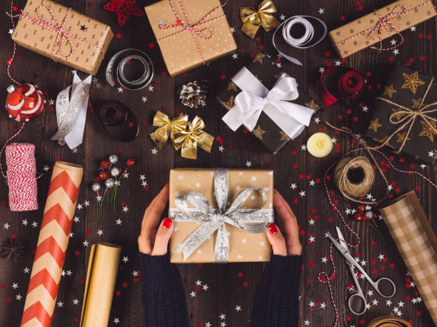 istock Woman in hand holding new year gift box 869662574