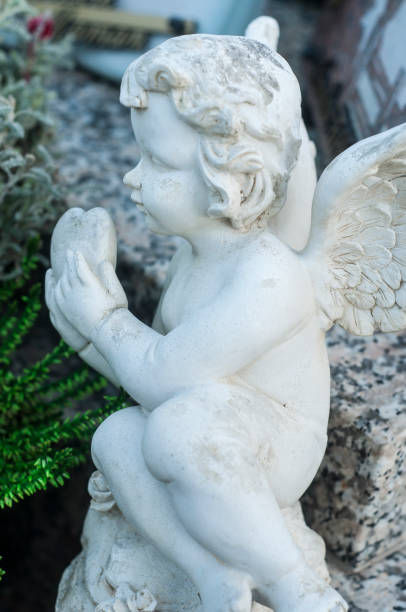 istock stoned angel in a cemetery 869664968
