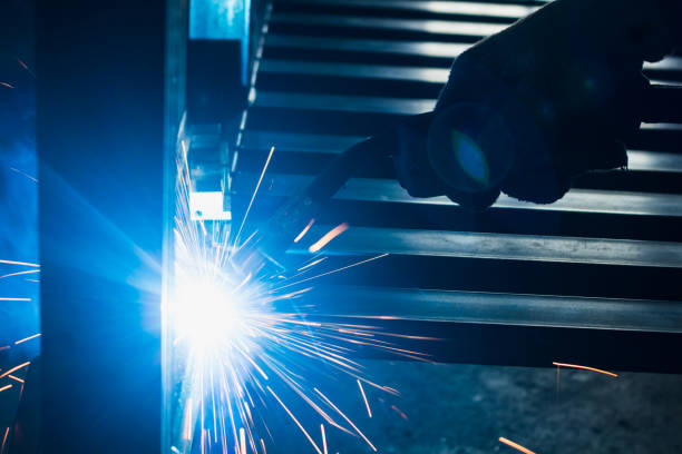 istock Wolker welding metal work blue arc with copy space 869665858