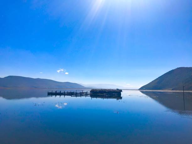 istock freshwater fish cage in the lake with charming blue clouds 869674640