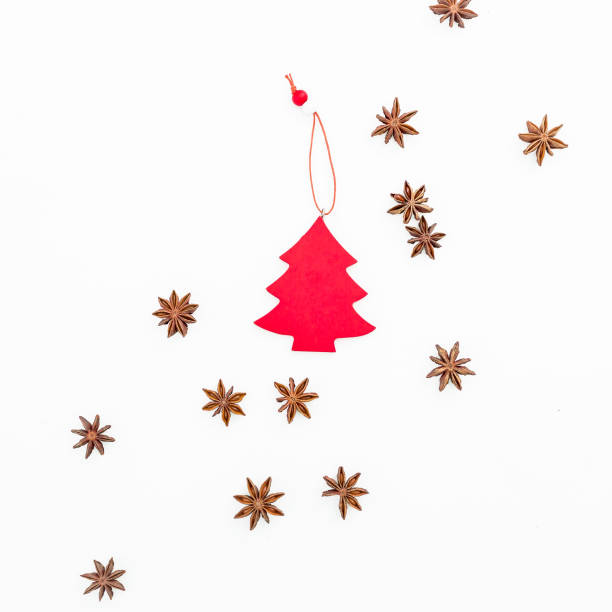 istock Christmas concept with decoration and cinnamon on white background. Flat lay, top view. 869674910