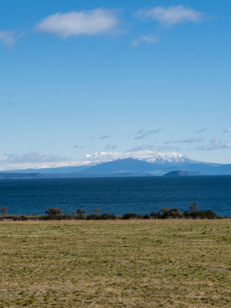 MOUNT DOO FROM LAKE ROTORUA - NEW ZEALAND THE VIEW OF MOUNT DOOM FROM LAKE ROTORUA - NEW ZEALAND rotorua luge stock pictures, royalty-free photos & images