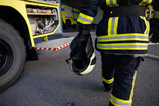 istock Rescue firefighter in safe helmet and uniform 869676536