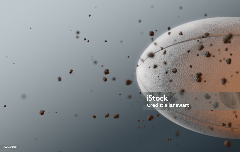 Rugby Ball In Flight A dirty white rugby ball caught in slow motion flying through the air scattering dirt particles in its wake - 3D render Rugby - Sport Stock Photo