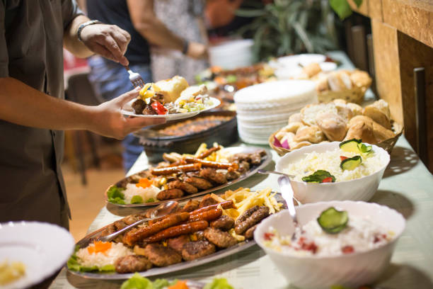 istock Group of people picking food 869682524