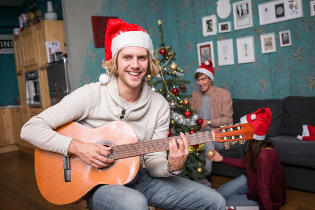 istock Friends celebrating Christmas: Giving presents 869683164